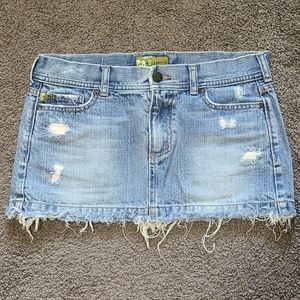 Distressed denim mini skirt